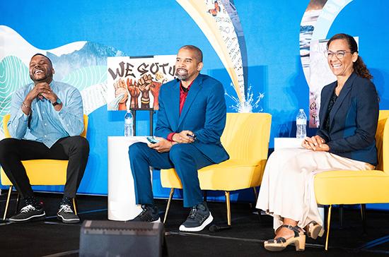 Michael, Dwayne, and Allison sitting on stage